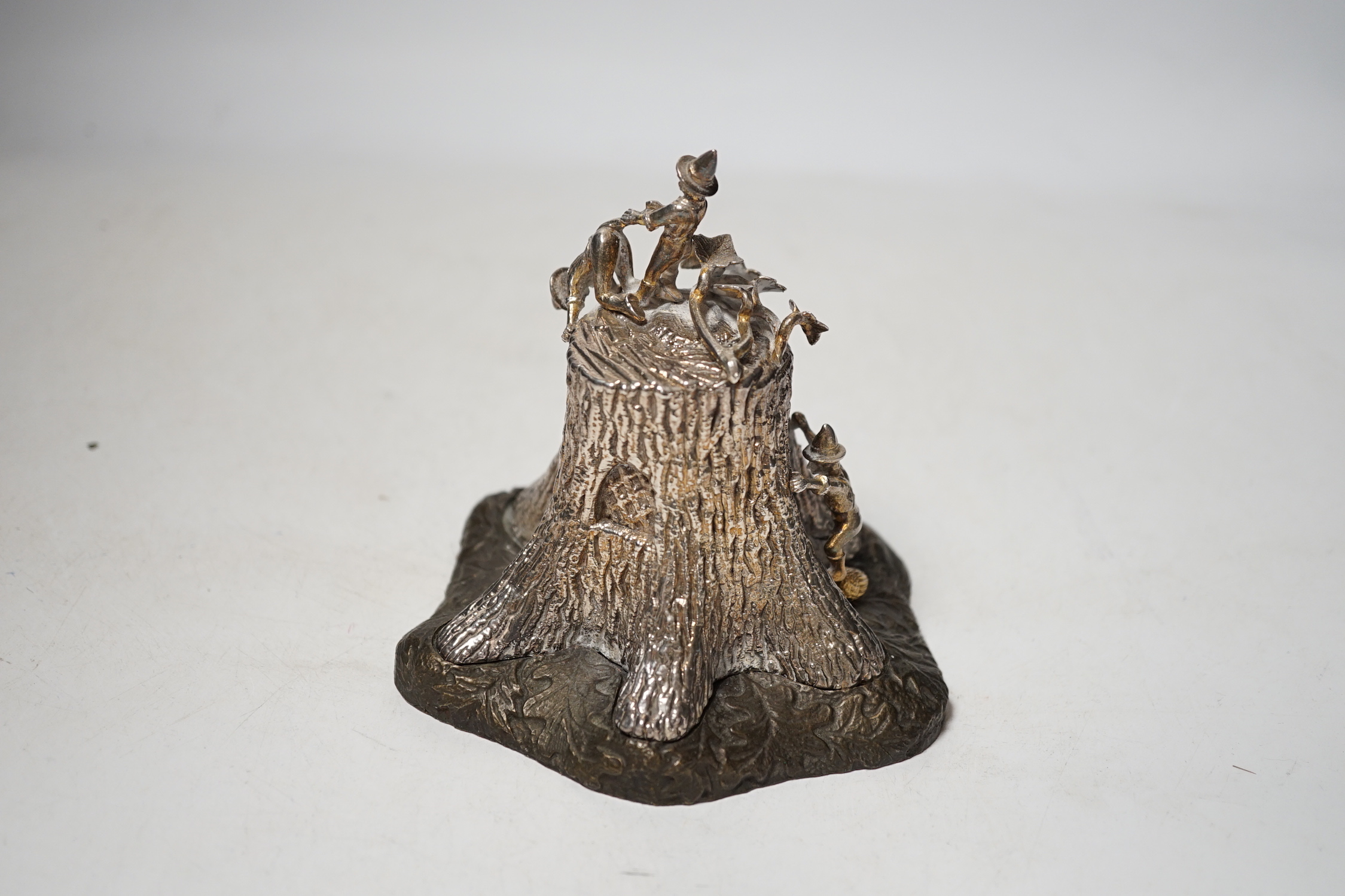 A limited edition Elizabeth II parcel gilt silver and base metal model by Christopher Nigel Lawrence, depicting pixies upon a tree stump, opening to reveal mice in kitchen scene, numbered 20/250, height 11.2cm.